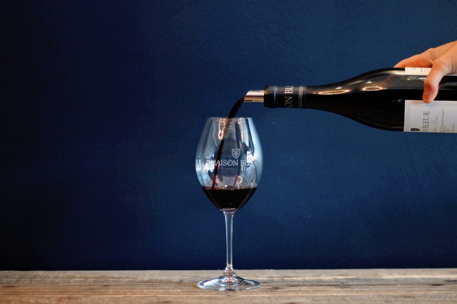 Maison Bleue wine being poured into a glass